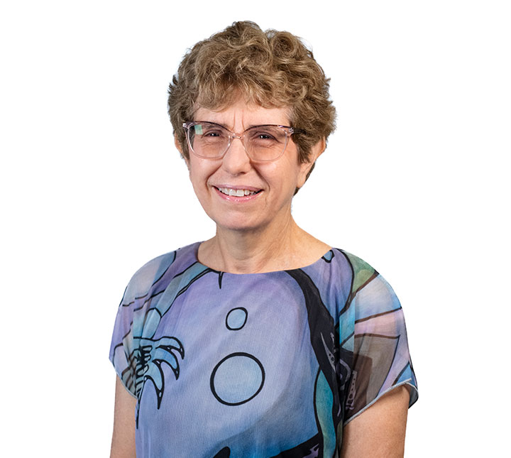 Mindy Goldman wearing a purple with bubbles shirt
