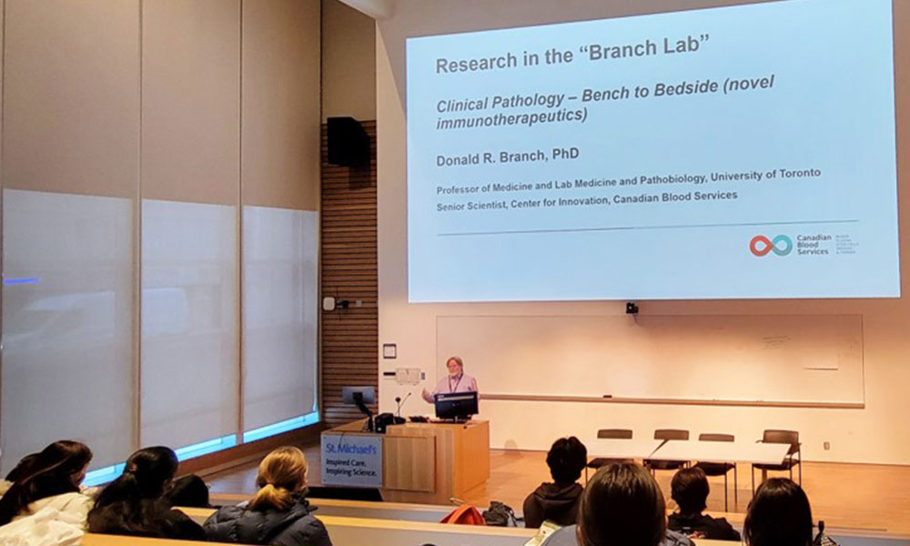 Dr Branch presenting slides