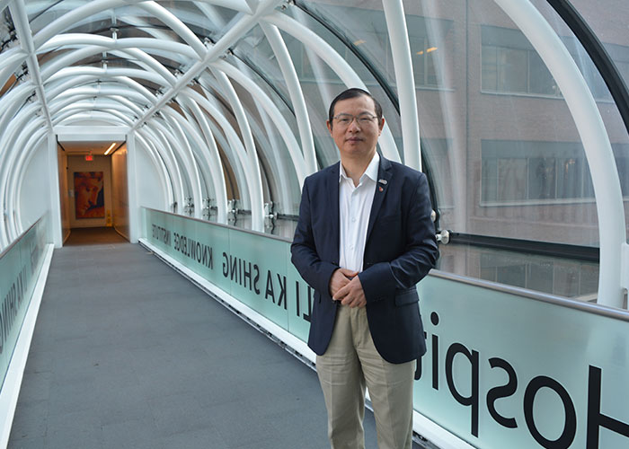 Dr Heyu Ni on a walk way