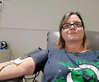 Blood donor in chair while donating