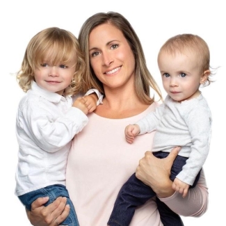 Nathaly, a mother who donated cord blood, holds her baby and toddler. 