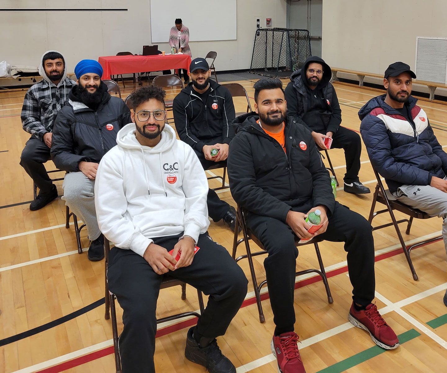 Group of first time donors sitting in a chair in the gymnasium