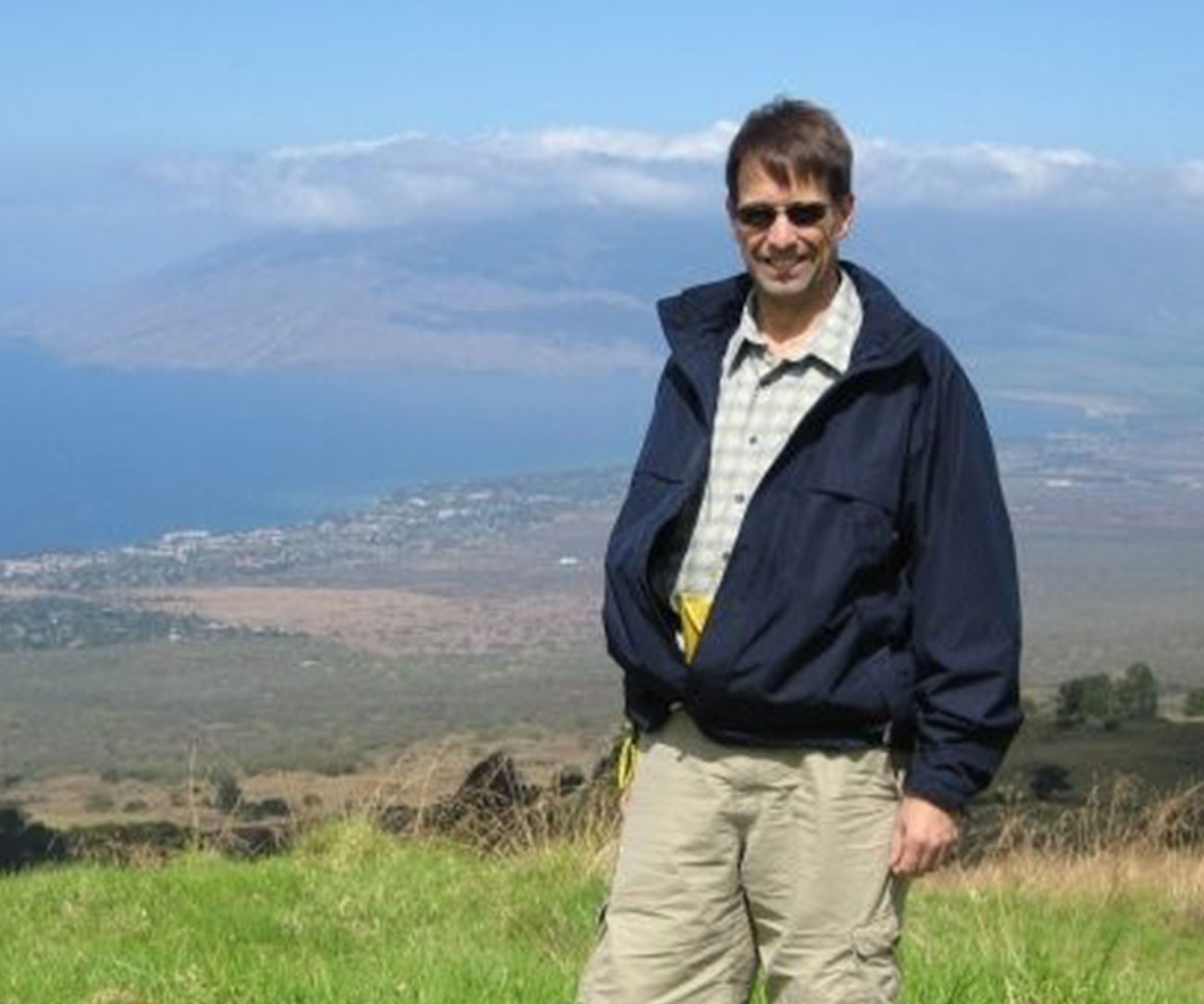 Two-time kidney recipient standing on hilltop in Hawaii