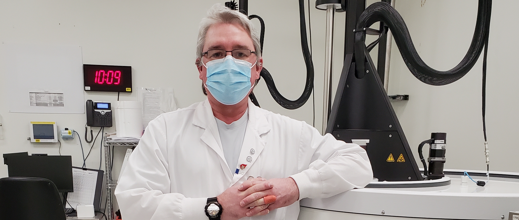 James McCarroll, leans on a piece of equipment at a Canadian Blood Services facility that processes stem cells for autologous stem cell transplants. 