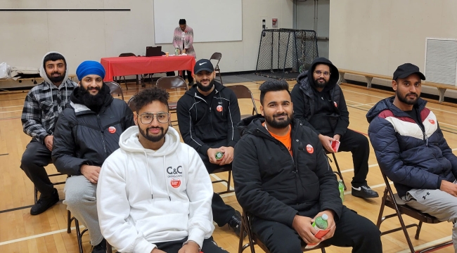 Group of first time donors sitting in a chair in the gymnasium