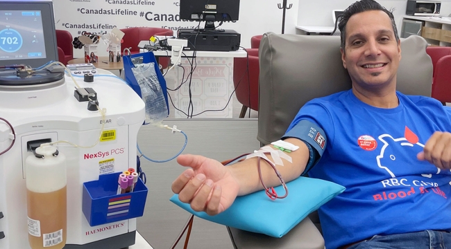 Plasma donor in a bed at a Canadian Blood Services plasma donor centre