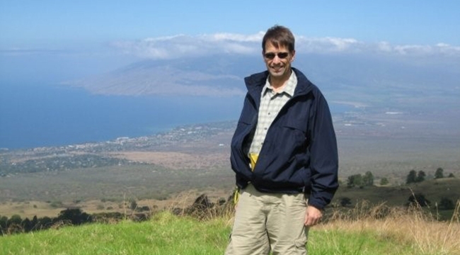 Two-time kidney recipient standing on hilltop in Hawaii