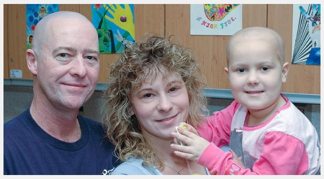 Five-year-old Rachelle with her family while in treatment for cancer