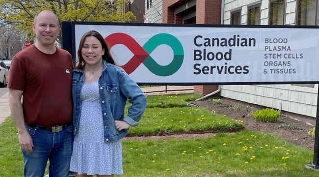 Greg and Hilary Dobbin stand in front of the donor clinic in Charlottetown, Prince Edward Island