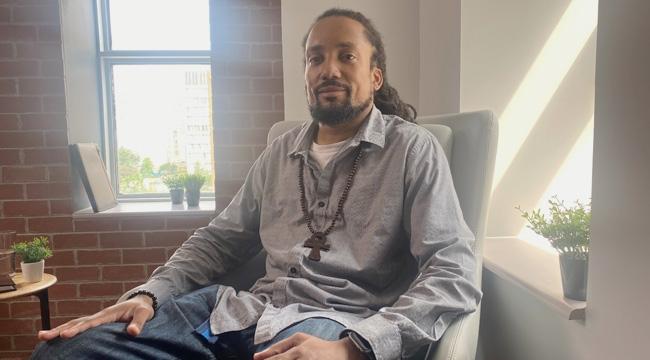 Man with sickle cell disease sits in an office in Toronto