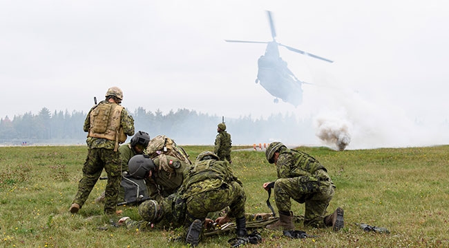 Soldiers on the battlefield with a helicopter